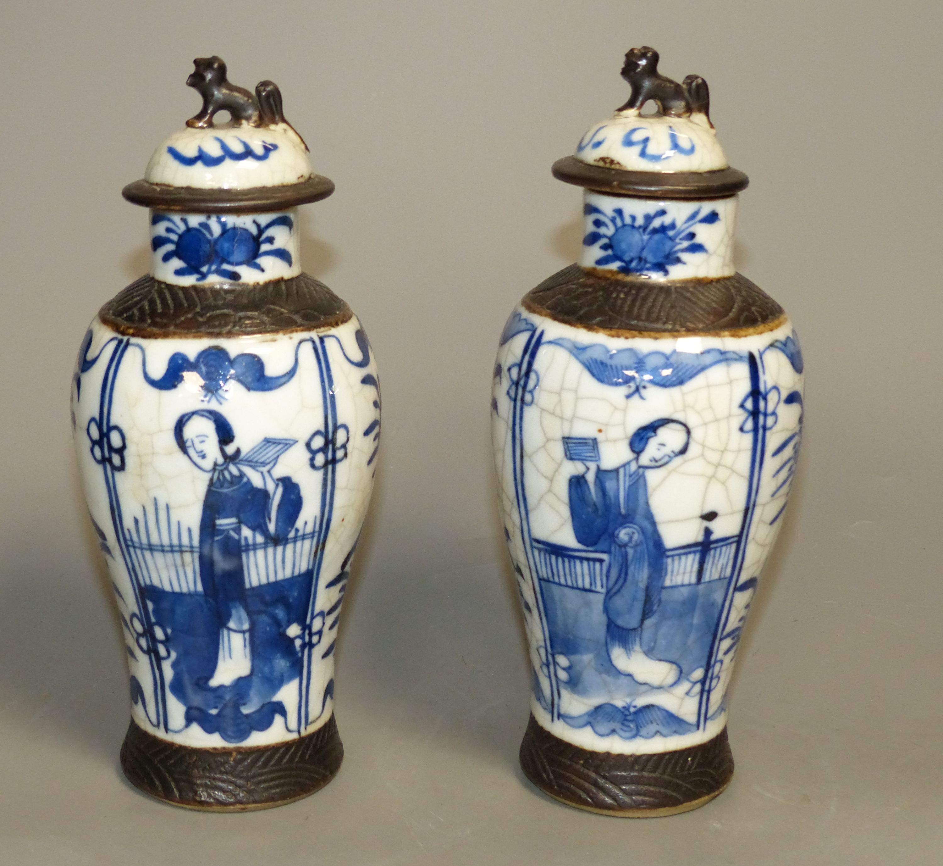 A pair of Chinese blue and white crackle glaze vases and covers, early 20th century, height 22cm